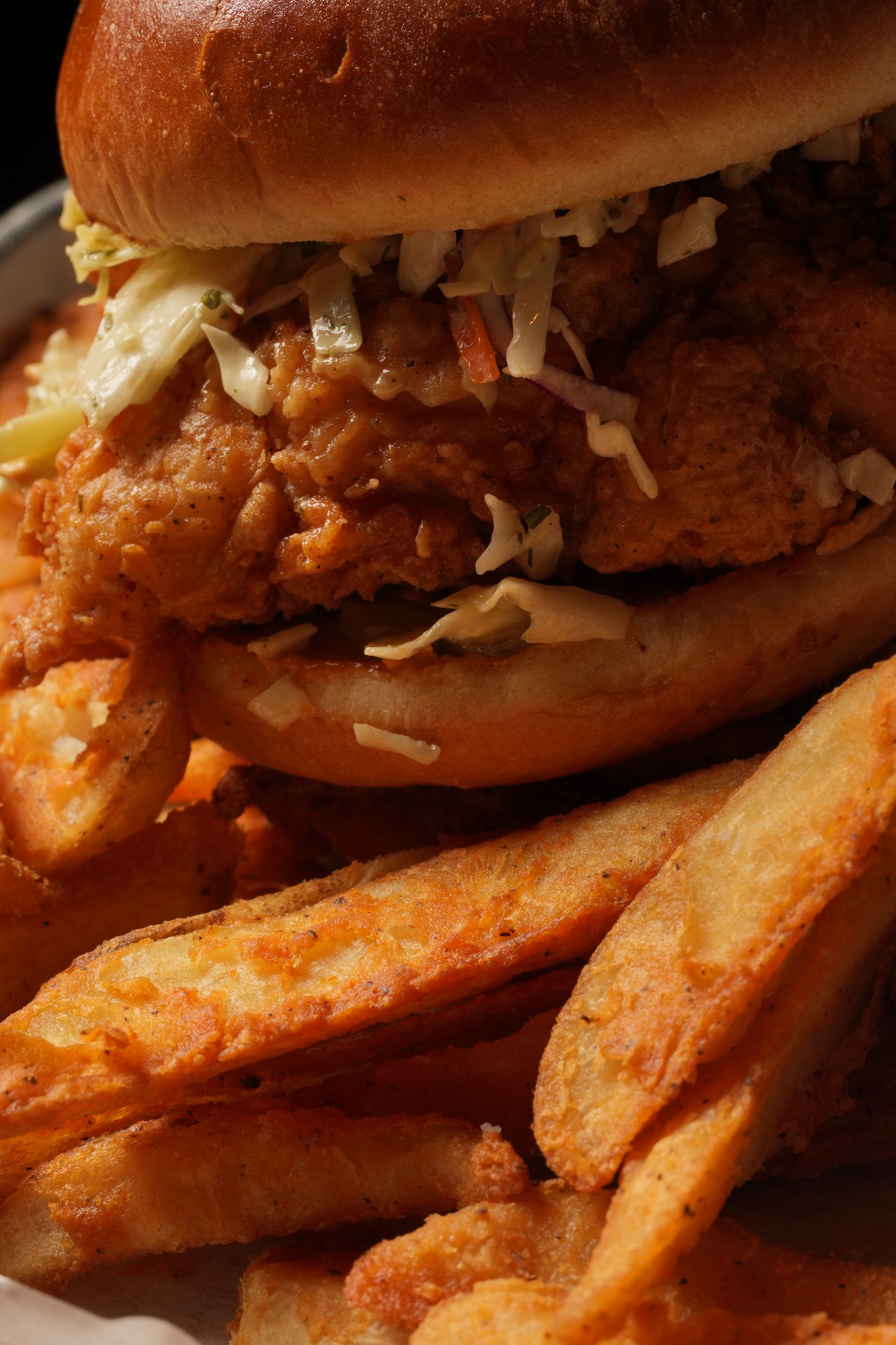 Spring Chicken tenders and seasoned wedges spread across branded packaging